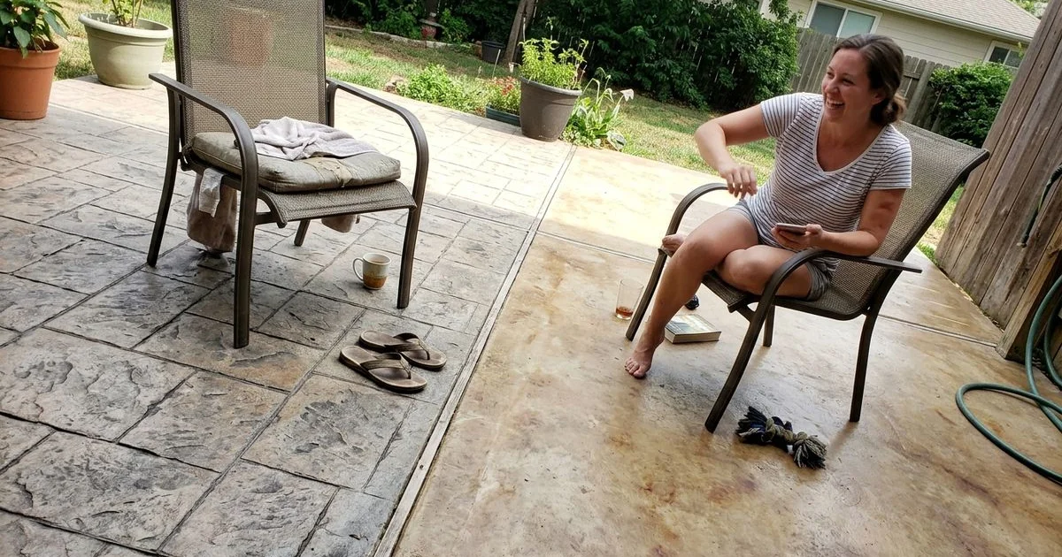 A stamped textured patio next to a smooth acid-stained floor